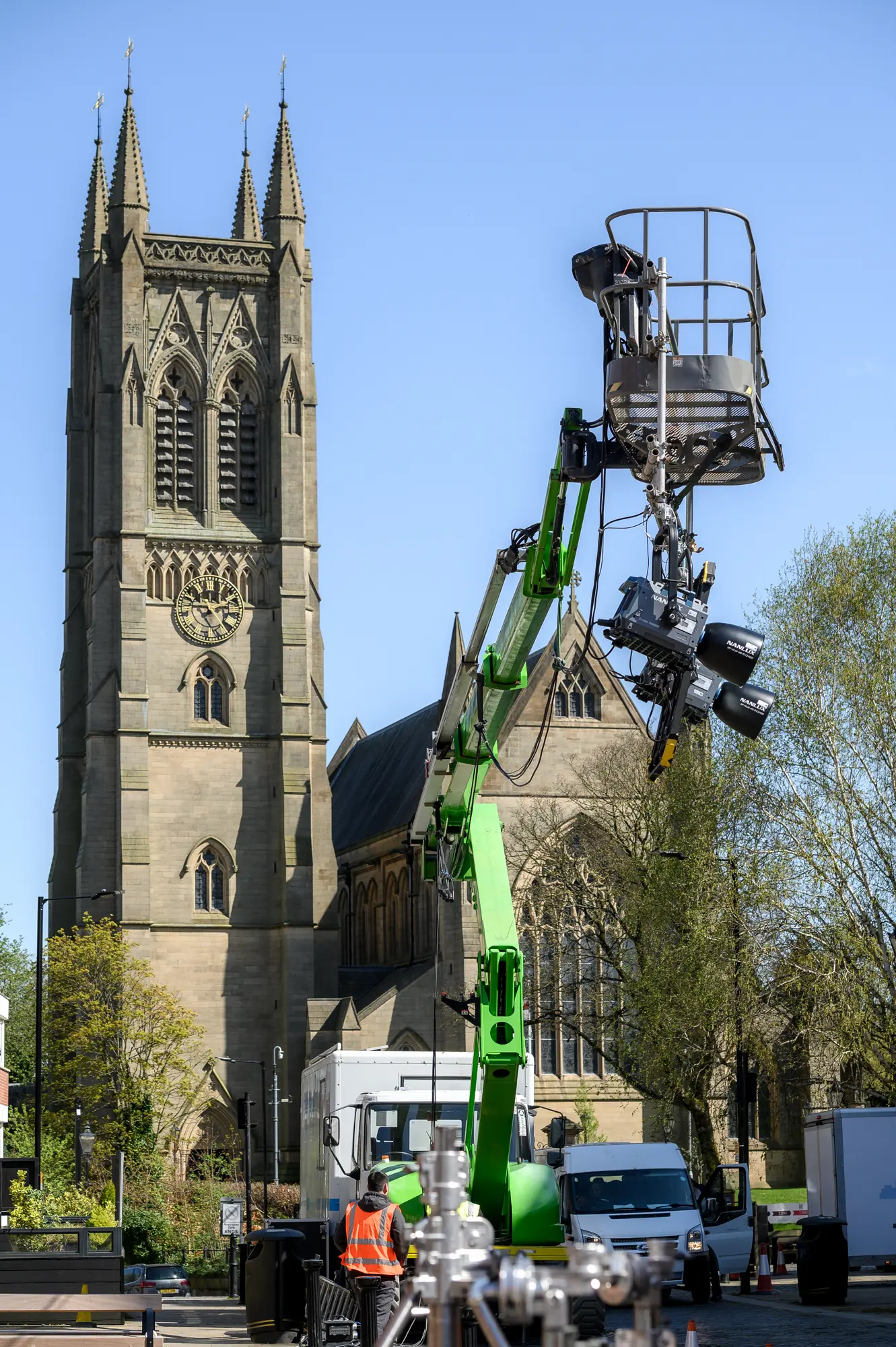 Film crew operating camera equipment outdoors