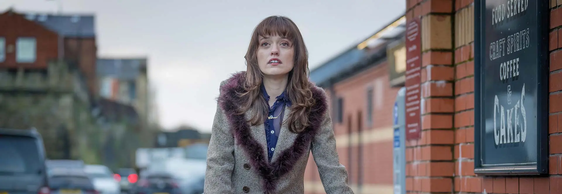 Woman stood outside cafe in Greater Manchester