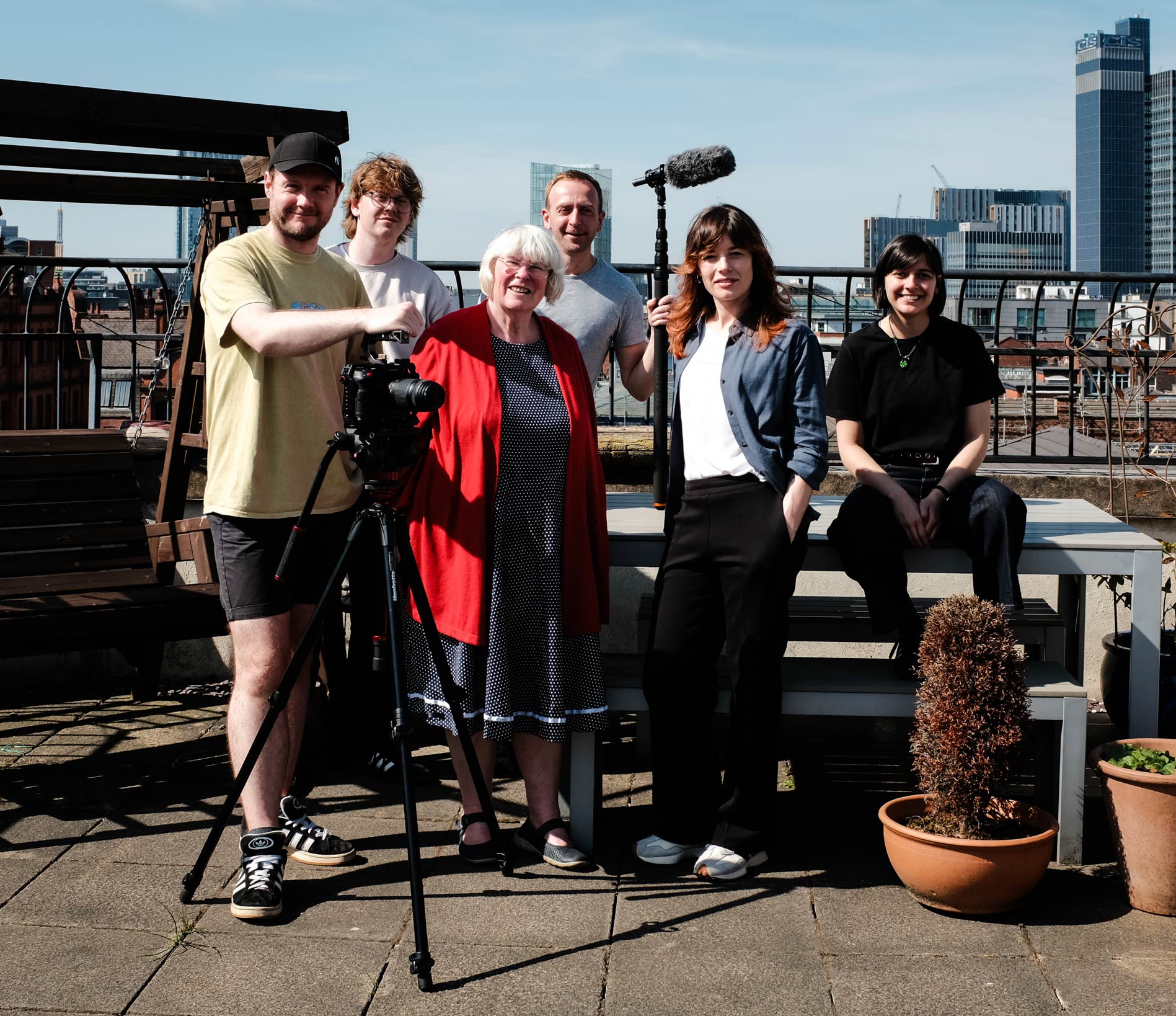 Film crew pause for a photo on Manchester skyline