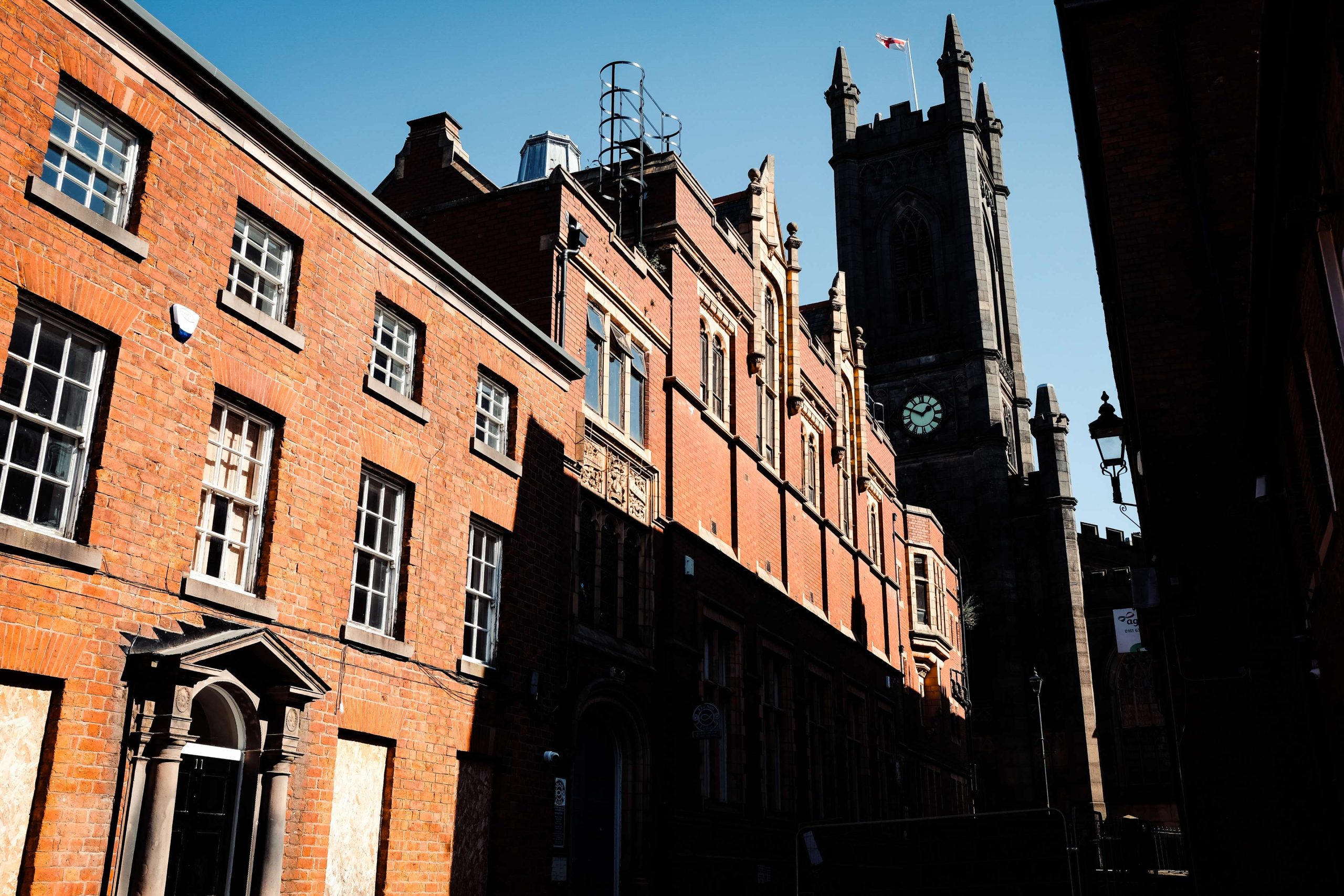 Snapshot of oldham town centre with church in backdrop